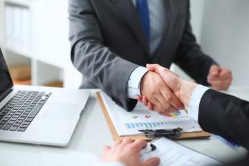 Business people shaking hands, finishing up a meeting