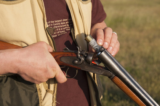 hunter holding a rifle