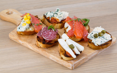 Tapas with cheese, salami and salmon