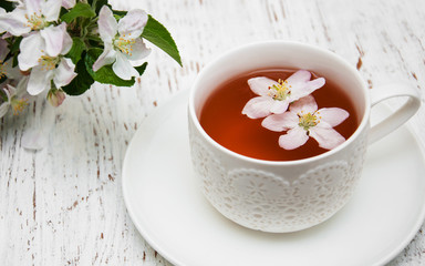 Cup of tea and spring blossom