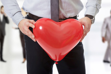 Man with heart balloon.