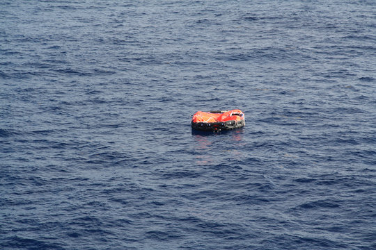 A Life Raft Floats In Mid Ocean Awaiting Rescue