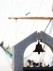 mast sailing ship on the background of the bell