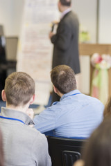 Male Lecturer Presenting Information in Front of the Group of Pe