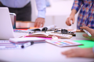 Fototapeta premium Young business people working at office on new project