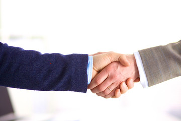 Closeup of a business handshake, on white background