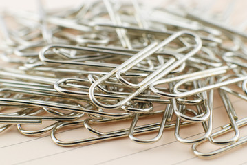 Paper clip and pink paper