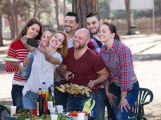 Smiling colleagues making mutual photo