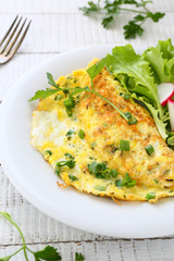 Omelette with herbs on plate