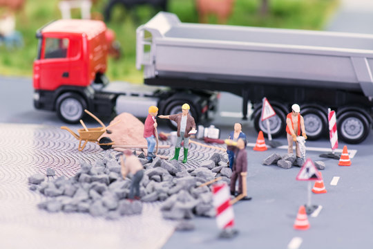 Road works with miniature figurines close-up