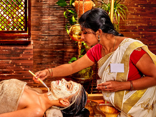Woman having mask at ayurveda spa. © Gennadiy Poznyakov