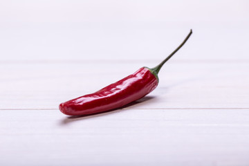 red chili pepper on wooden background