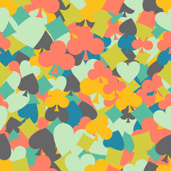 Seamless colorful background made of card suit in flat design
