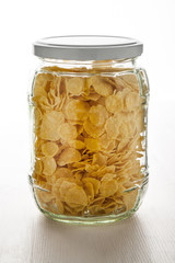 Glass jar of corn flakes