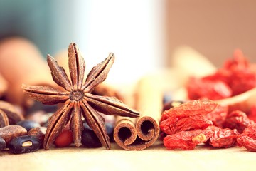 Nuts and chinese herb on wood background.
