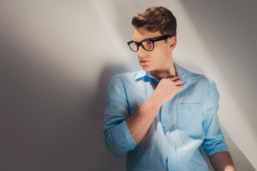 casual man posing on grey studio background