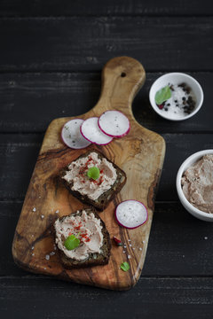 sandwiches with chicken liver pate on olive Board