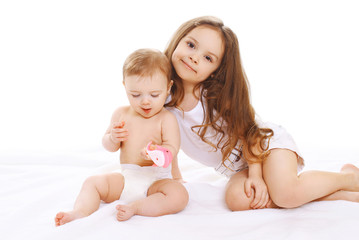 Portrait of two sisters children playing together and having fun