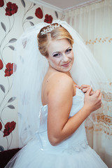 Beautiful caucasian bride getting ready for the wedding ceremony