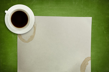 Obraz na płótnie Canvas Green blackboard background with coffee cup and empty paper