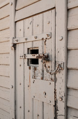 Old locked door with chain and padlocks