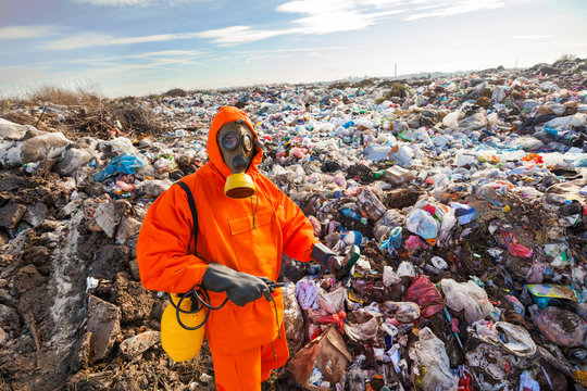 Environmental engineer standing on the landfill