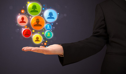 Social network icons in the hand of a businessman