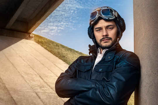 Retro Pilot Portrait with Glasses and Vintage Helmet
