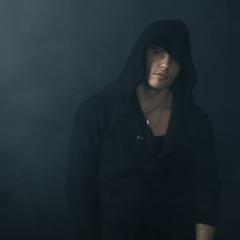 strong man in  black hoodie
