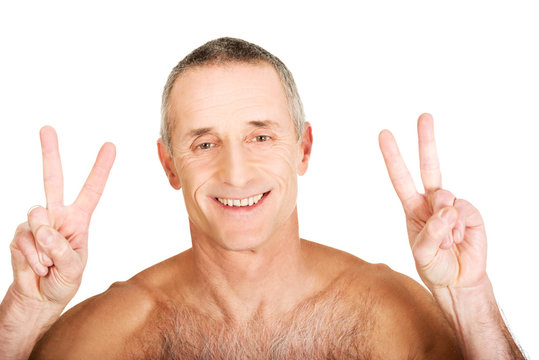 Mature Shirtless Man With Victory Sign