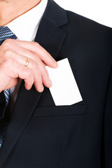 Businessman taking a blank card from pocket