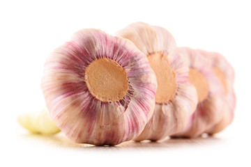 Composition with bulbs of garlic isolated on white