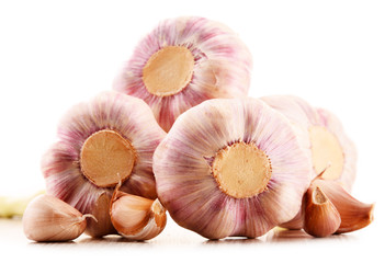 Composition with bulbs of garlic isolated on white