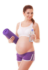 Beautiful pregnant woman with exercising mat and water on white