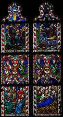  Stained glass window depciting various bible scenes