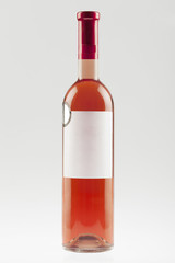 Red wine bottle with empty label and sticker