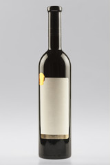 Red wine bottle with empty label and sticker