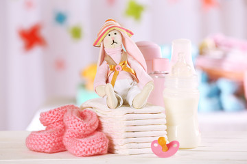 Fototapeta na wymiar Baby accessories on table on light background