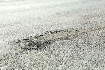 Very bad quality road with potholes