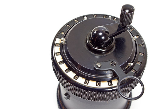 Vintage mechanical calculator on white