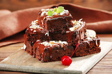 Delicious chocolate cakes on table close-up