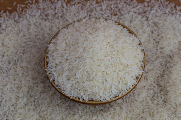 White long rice background, uncooked raw cereals, macro closeup
