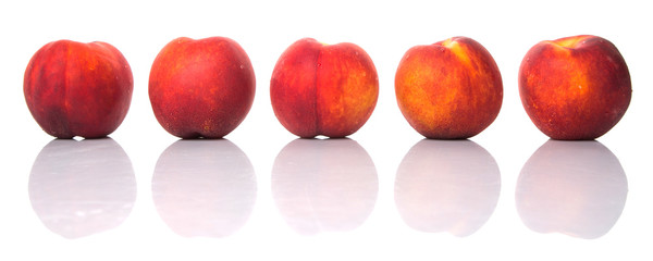 Nectarine fruits over white background