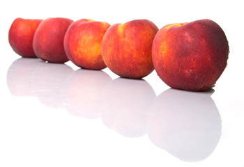 Nectarine fruits over white background