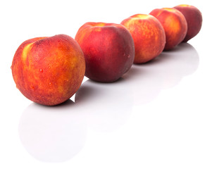 Nectarine fruits over white background