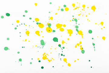 Bright paint blots on paper close up