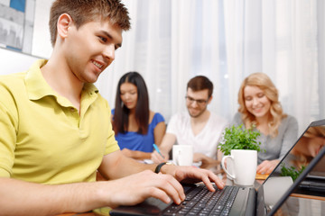 Team of developers making notes and discussing the project 