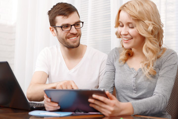 Portrait of a young developer and his female colleague 