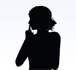 Obraz na płótnie Canvas woman silhouette with hand gesture hush