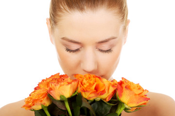Fototapeta premium Smiling woman with fresh roses.